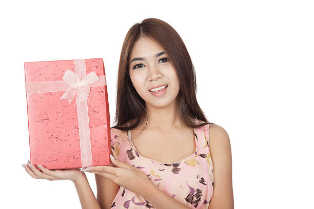 istock Beautiful Asian woman smile with red gift box 517799603