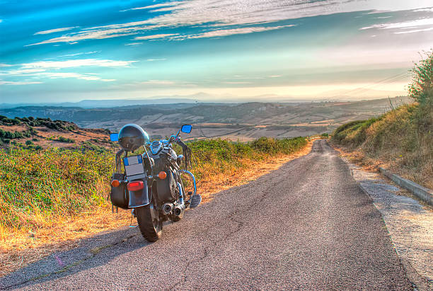 istock motorcycle on edge of the road 517799703