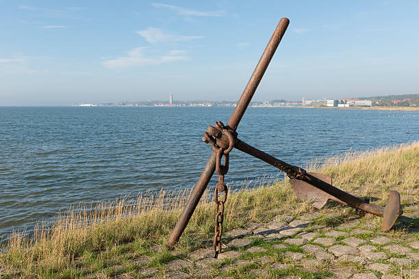 Old rusted anchor on an island. Old rusted anchor on the island Terschelling in the Netherlands. hook of holland stock pictures, royalty-free photos & images