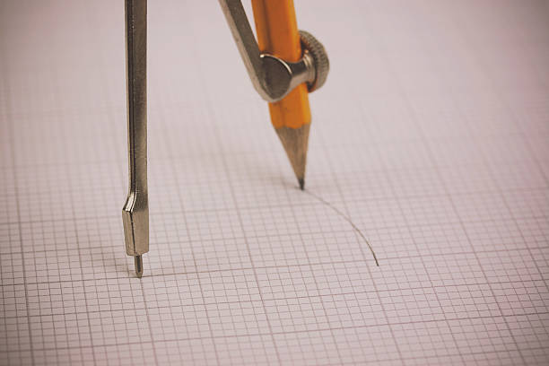istock Close up of a compass on graph paper 517801272