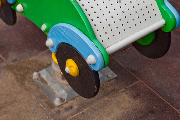 istock Green wooden car on playground 517801861