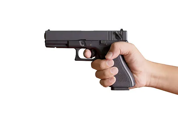 Photo of Hand with gun