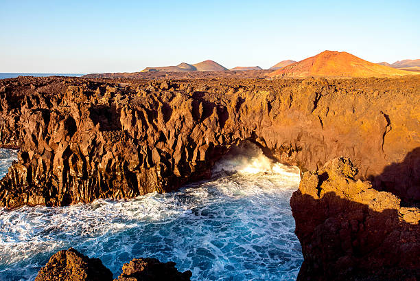 istock Rocky coast with wavy ocean on Lanzarote island 517804254