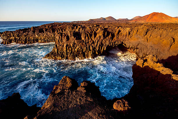 istock Rocky coast with wavy ocean on Lanzarote island 517804522
