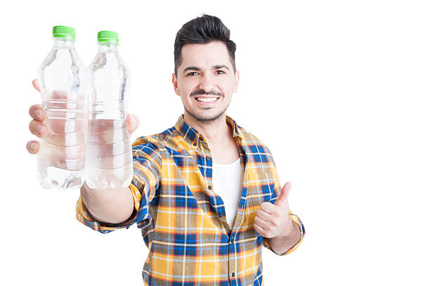 istock Handsome smiling man thumb-up and encourage water consumption 517804692