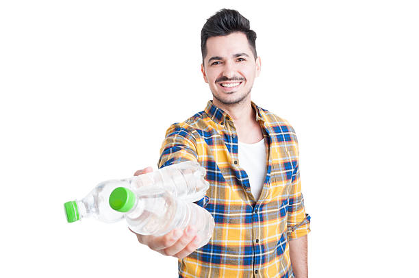 istock Beautiful and smiling young man offering cold water for hydratio 517804708