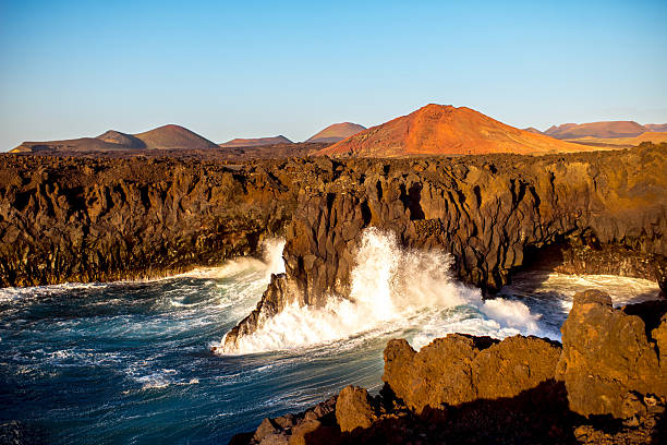istock Rocky coast with wavy ocean on Lanzarote island 517804974