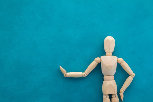 istock wood man figure with area for your text 517805530