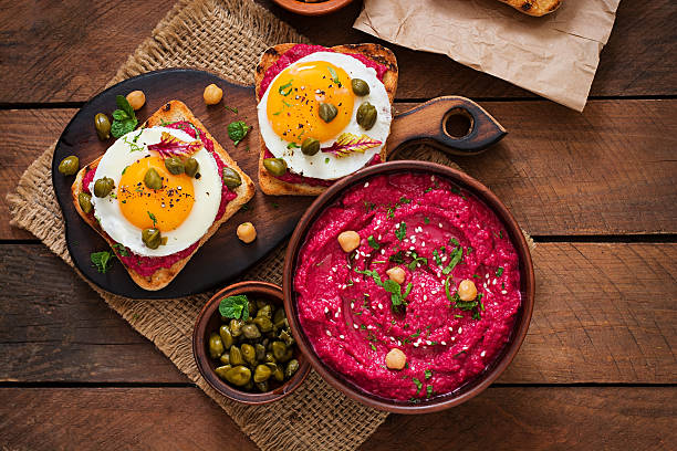 istock Diet sandwiches with beet root hummus, capers and egg 517805656