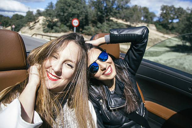 istock Women in a convertible car 517806406