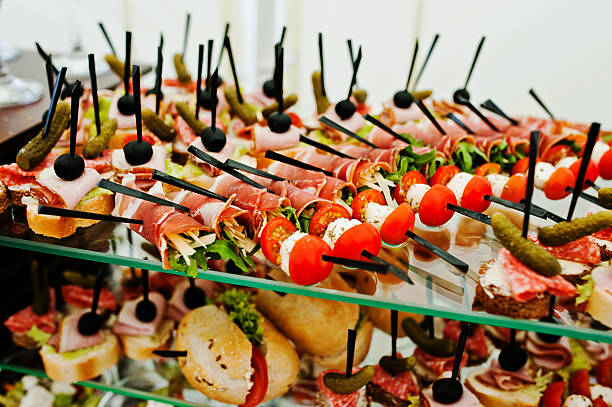 istock Buffet table of reception with burgers, cold snacks 517807268