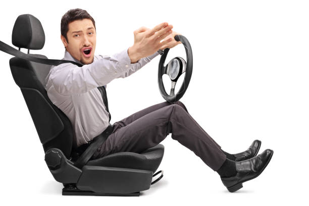 istock Angry young guy holding a steering wheel 517807530