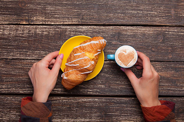 istock Female hands holding cup of coffee 517811391