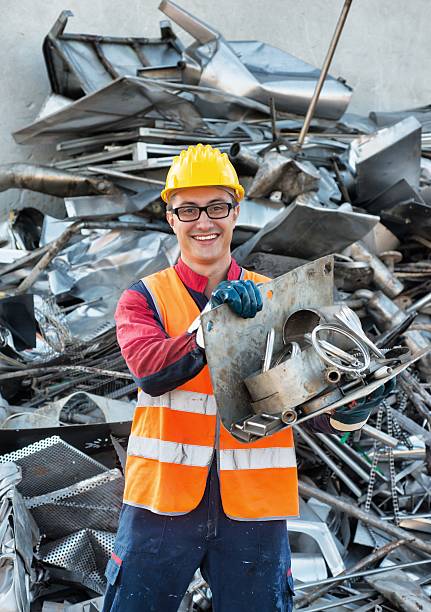 istock Smiling Worker in Metal Landfill 517812863