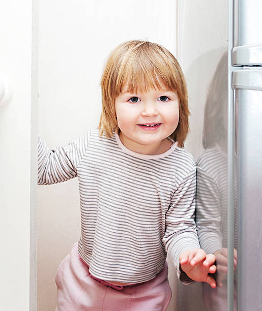 istock Little girl having fun playing at home 517814403