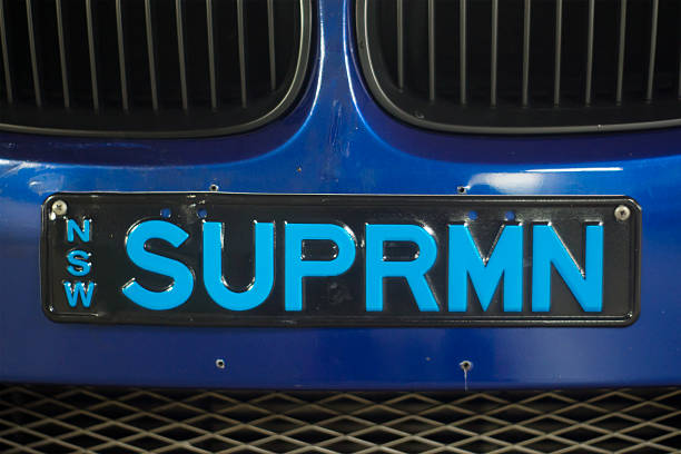 SUPRMN Sydney, Australia - April 9, 2014: A NSW registration plate with the letters SUPRMN, affixed on the front of a blue BMW car. superman named work stock pictures, royalty-free photos & images