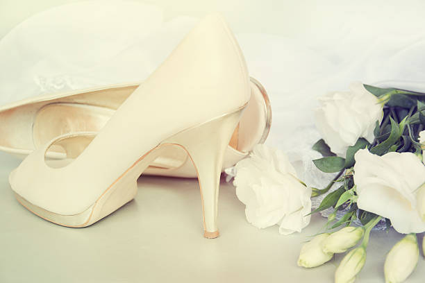 istock Bride shoes with flowers. 517816529