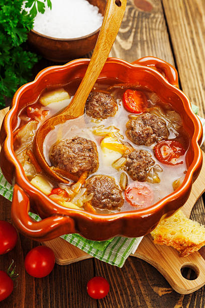 istock Cabbage soup with meatballs and tomatoes 517816669