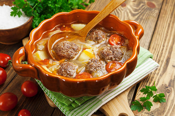 istock Cabbage soup with meatballs and tomatoes 517816671