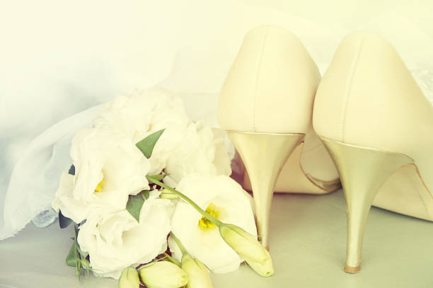 istock Bride shoes with flowers. 517817957