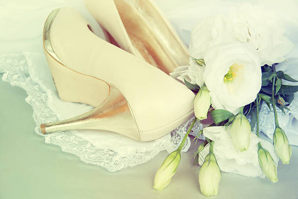 istock Bride shoes with flowers. 517818015