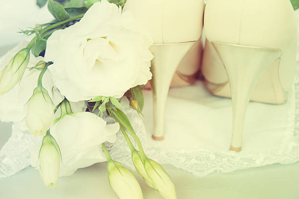 istock Bride shoes with flowers. 517818065