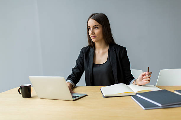 istock Young woman in the office 517818231