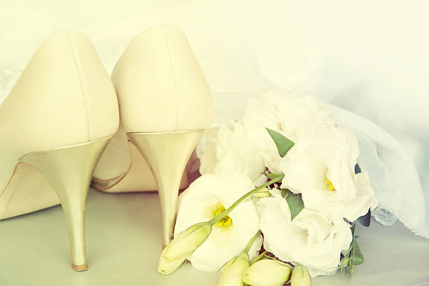 istock Bride shoes with flowers. 517818597