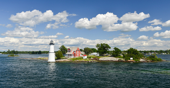 House with lighthouse in the Thousand Islands on Saint Lawrence River.