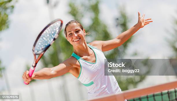 Young Woman Playing Tennis Stock Photo - Download Image Now - Activity, Adult, Adults Only