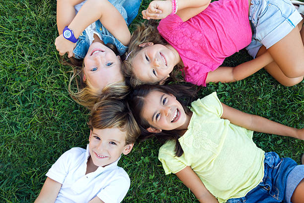 istock Group of childrens having fun in the park. 517831253