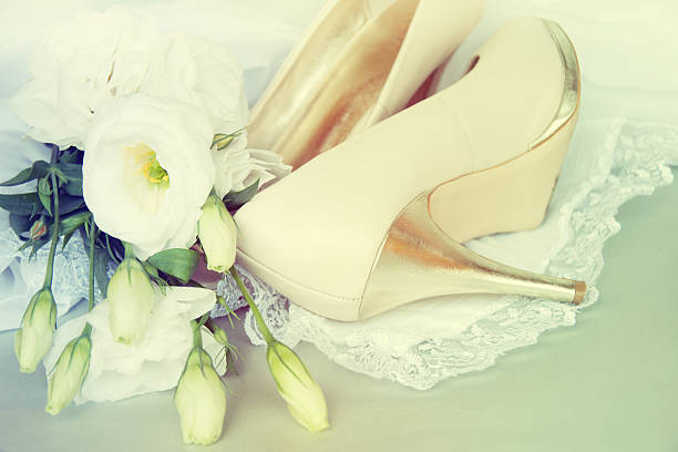 istock Bride shoes with flowers. 517831315