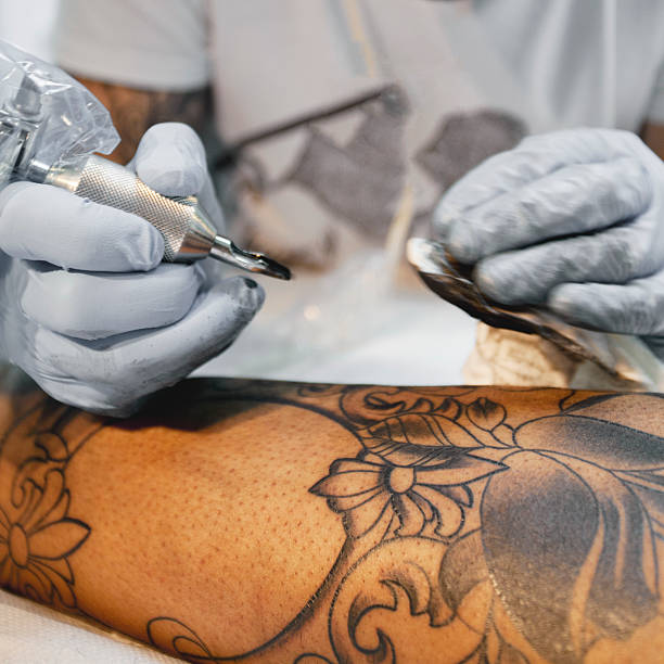 istock Tattoo artist working on a new project 517832375