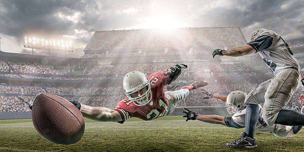American Football Touchdown INSPECTOR PLEASE NOTE: Stadium is fake, created in Photoshop. New image from old shoot, dates on releases are correct, and all players are same model. Thanks offense sporting position photos stock pictures, royalty-free photos & images