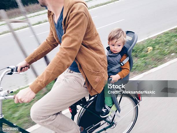 Father And Baby Cycling Together Stock Photo - Download Image Now - 12-17 Months, Activity, Asphalt