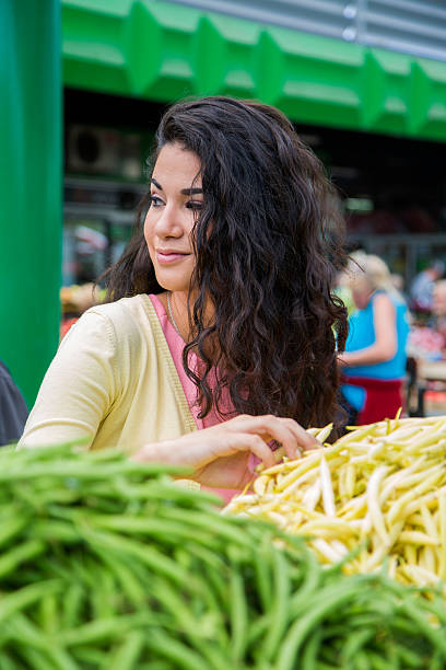istock Young woman at the market 517834217