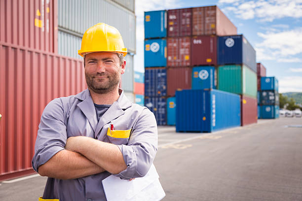 istock adult worker in large container port 517834539