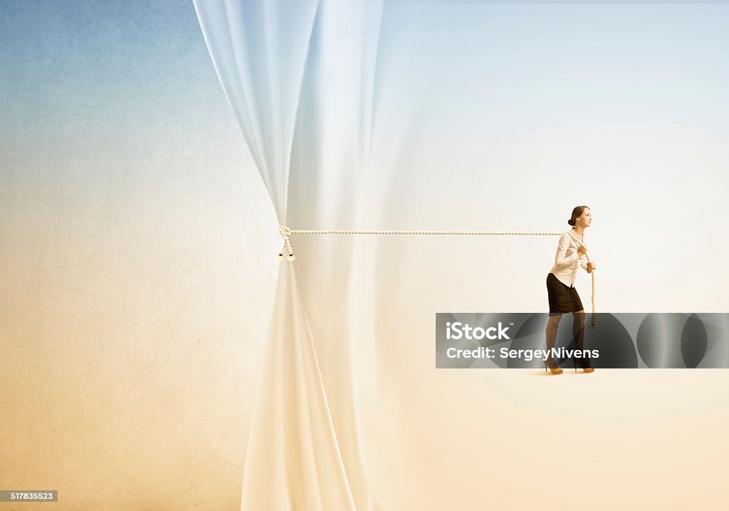 Advertise concept Young businesswoman pulling curtain with rope. Place for text Adult Stock Photo