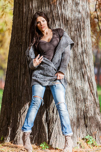 istock Young woman at autumn park 517835591