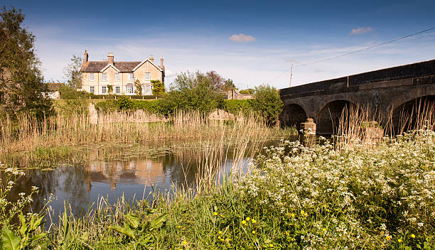 King's Mill Sturminster Newton, Dorset - May 28, 2012: A farmhouse overlooking the River Stour at King's Mill in the Blackmore Vale of Dorset. blackmore vale stock pictures, royalty-free photos & images