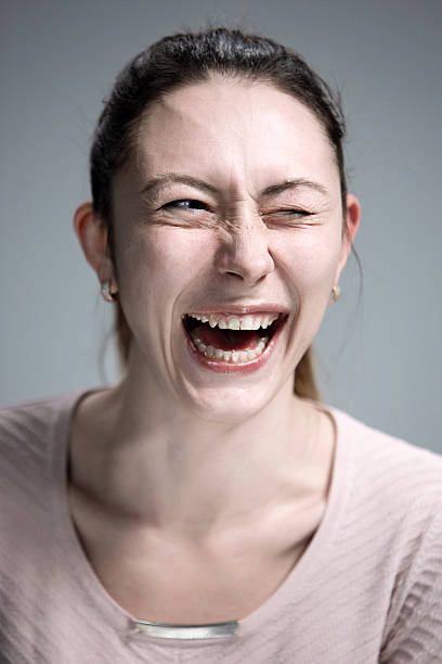 istock The happy woman on gray background 517838228