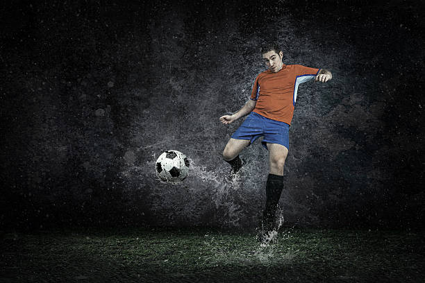 istock Splash of drops around football player under water 517838640