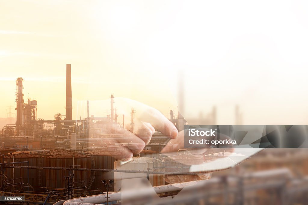 Industrial Double ExposureImage Industrial Complex and Tablet Digitally Generated Image Stock Photo