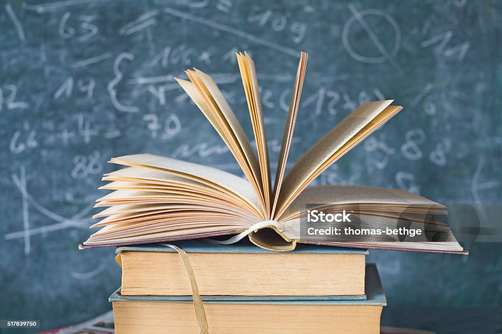 open book with black board open book with black board, education and learning concept Book Stock Photo