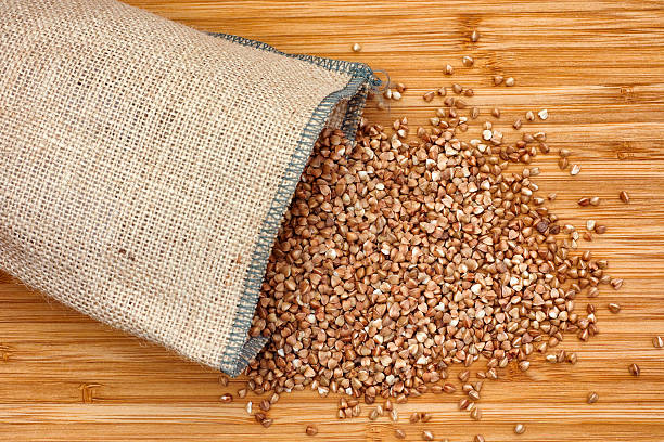 istock Buckwheat spilling out of burlap bag 517842676