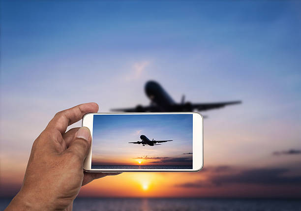 istock Hand with smart phone shooting photograph 517843358