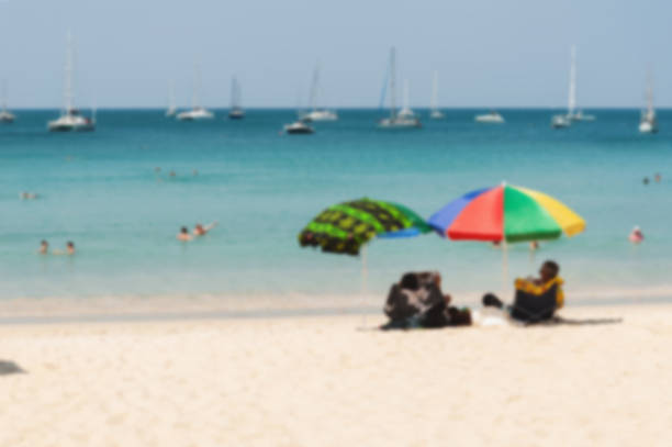 istock Blurred blue sea and white sand beach 517843480