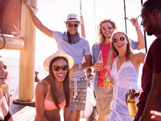 istock Multi ethnic friends laughing and smiling on a yacht 517844470