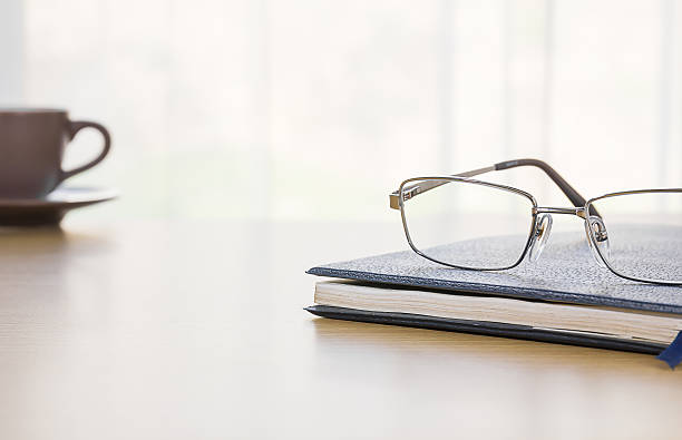 istock Glasses and a book on the desk 517844910