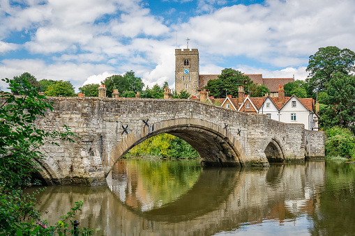 View of Aylesford village in Kent, England with medieval bridge and church.